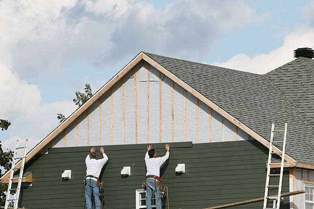 Professional Siding Contractor technician working in Holly Springs, NC
